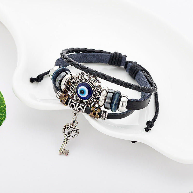 Cowhide bracelet & Hollow alloy insert Evil eye