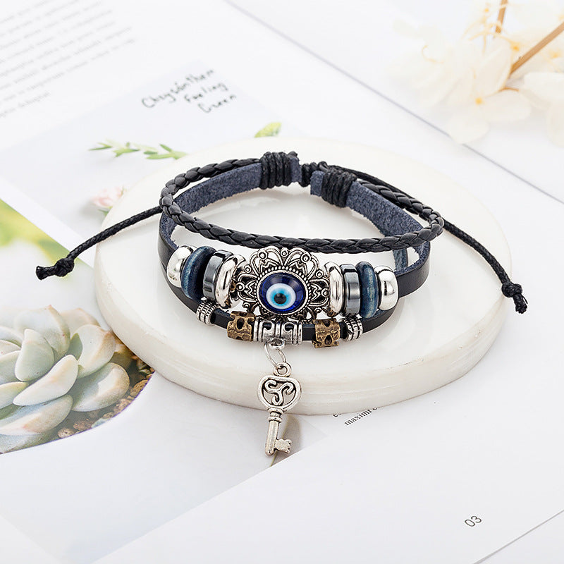 Cowhide bracelet & Hollow alloy insert Evil eye